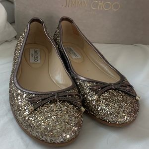 Jimmy Choo flats. Worn once. Comes with box and dust bag